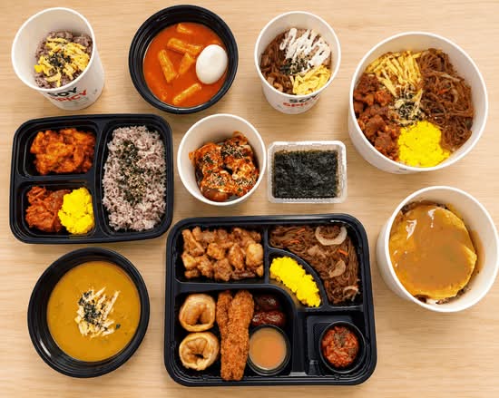 A spread of Soy or Spicy rice bowls, Korean lunch boxes, tteokbokki and curry